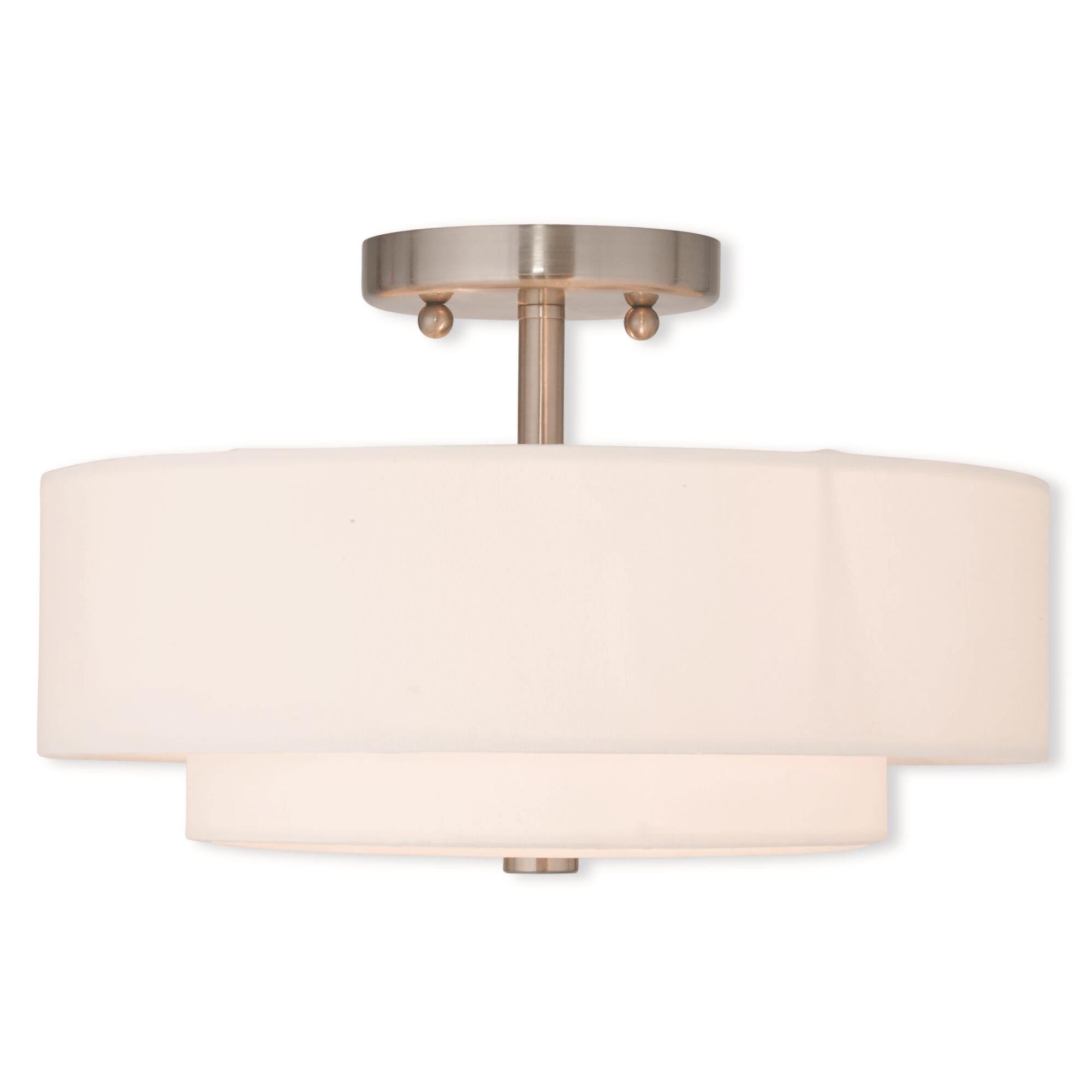 Shown in Brushed Nickel finish and Hand Crafted Off-White Fabric Hardback shade